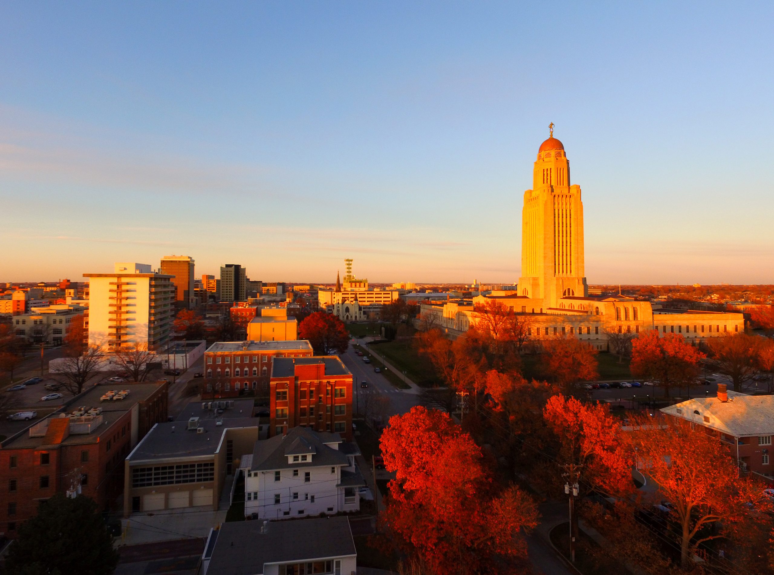 Lincoln Nebraska State Capitol building at sunset in autumn, highlighting statewide opportunities for EEG tech jobs